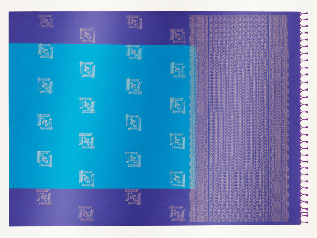 Full-length view of the Aruvi saree showing the turquoise body and violet woven pallu laid flat.