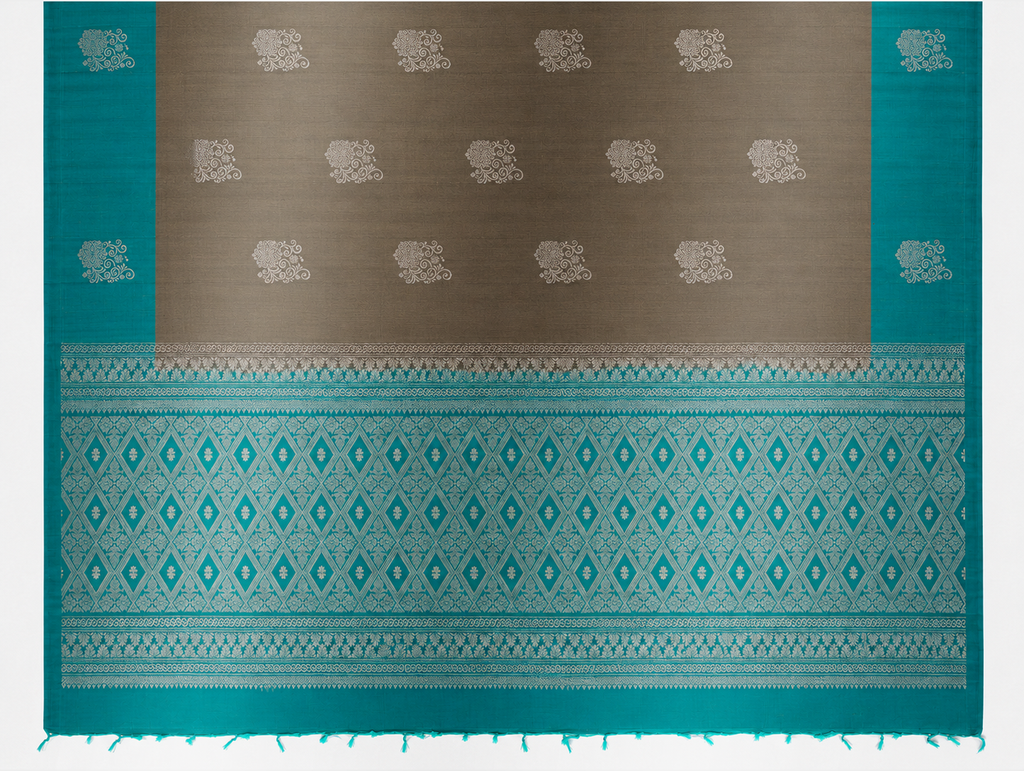 Kayal antique bronze and turquoise pure silk saree showing silver medallion body and diamond-woven pallu