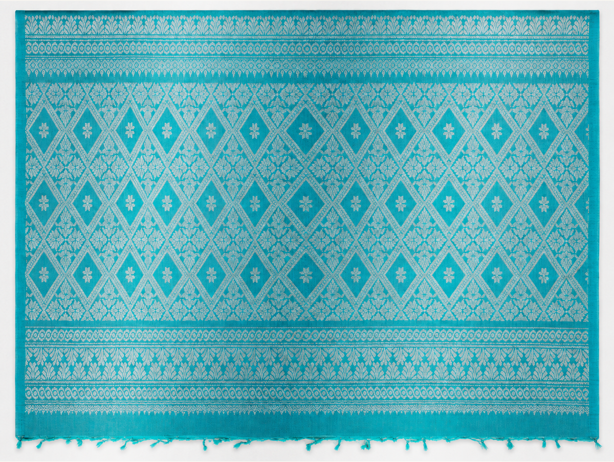 Kayal turquoise pallu with silver diamond lattice woven bands and short loose tassels