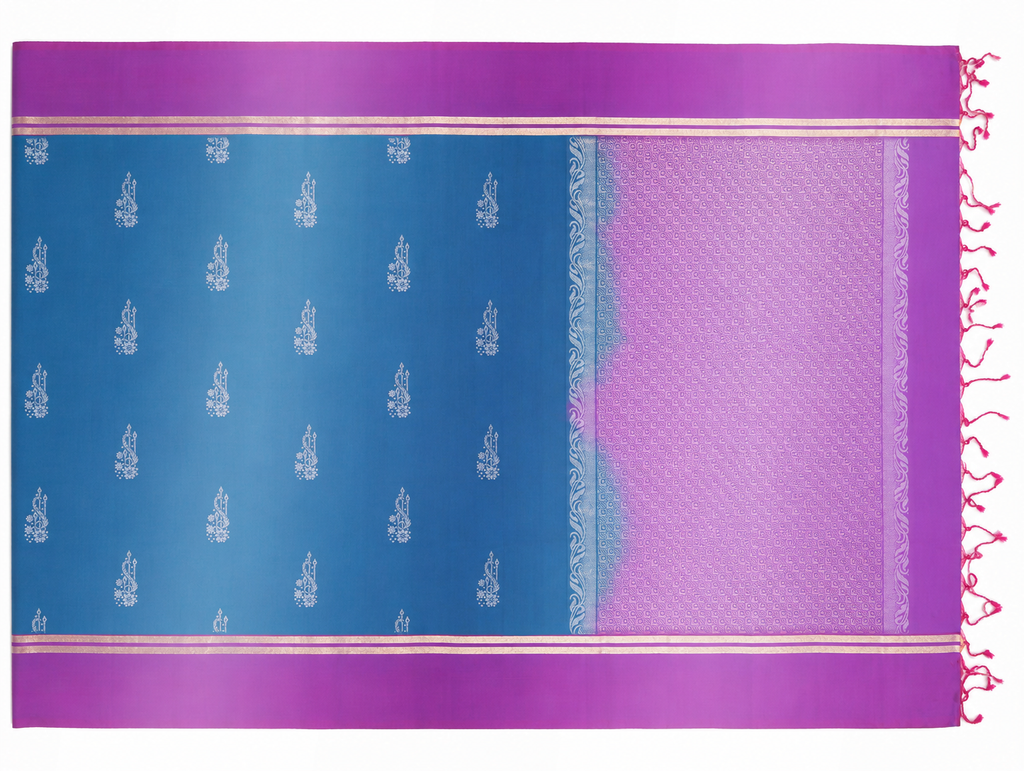 Full product view of the Neela pure silk saree showing its royal-blue body, orchid-magenta purple borders, silver woven sprigs, geometric pallu and tassels.