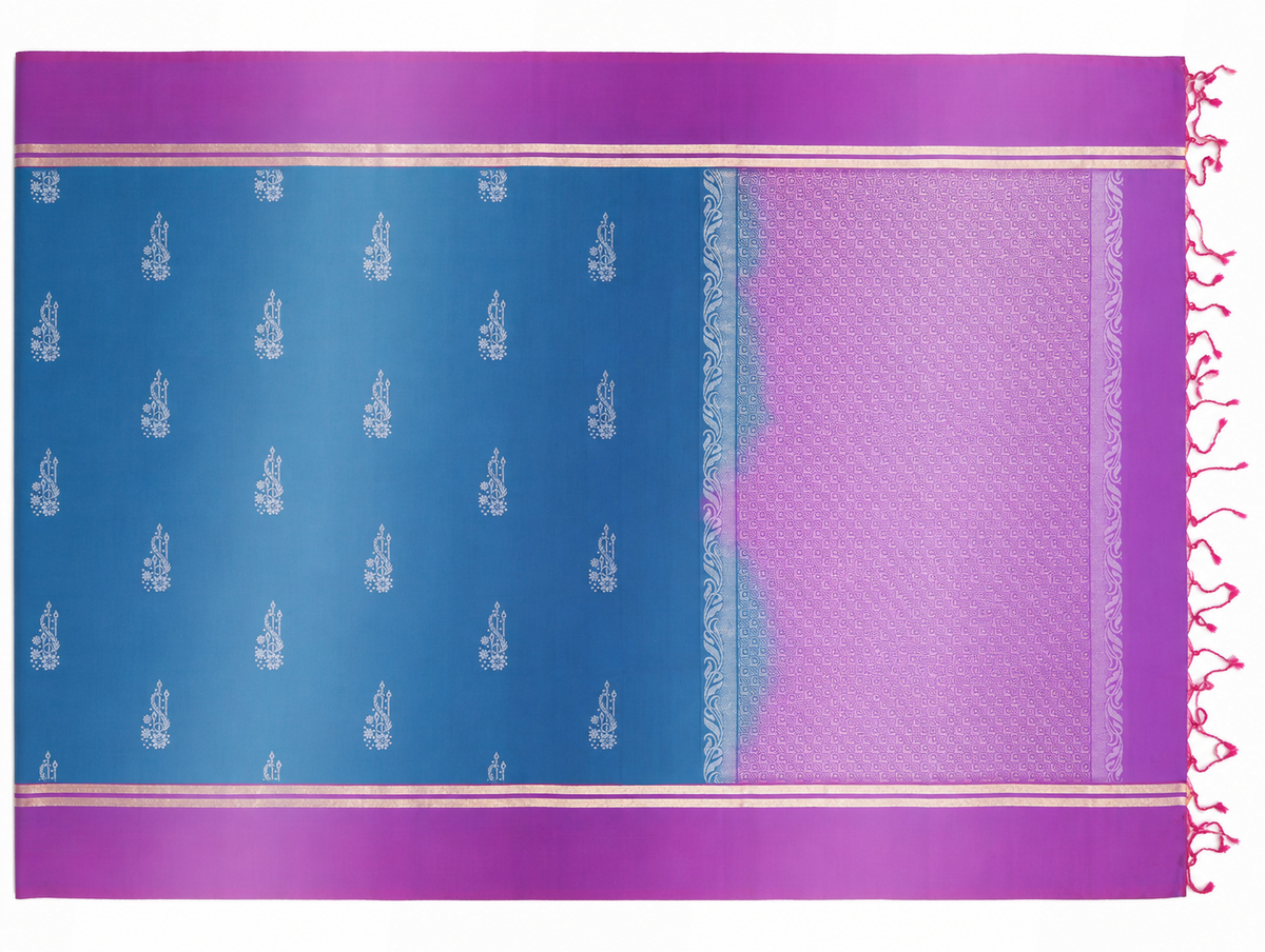 Full product view of the Neela pure silk saree showing its royal-blue body, orchid-magenta purple borders, silver woven sprigs, geometric pallu and tassels.