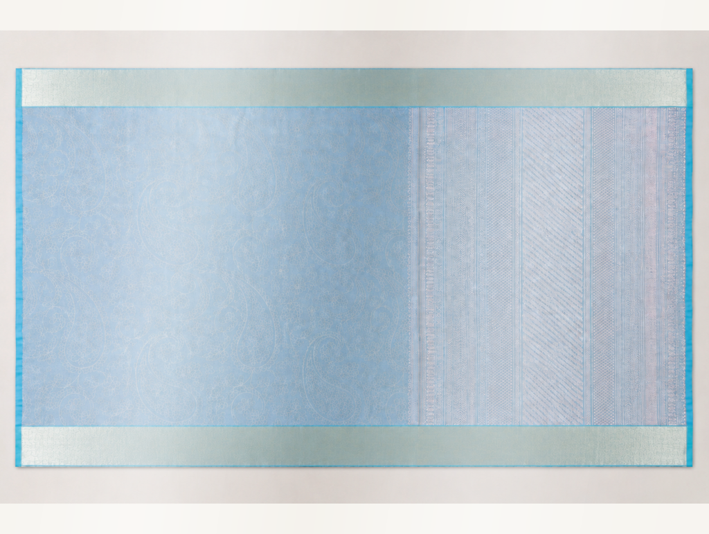 Thendral ice blue and silver pure silk saree showing the floral paisley body and geometric woven pallu