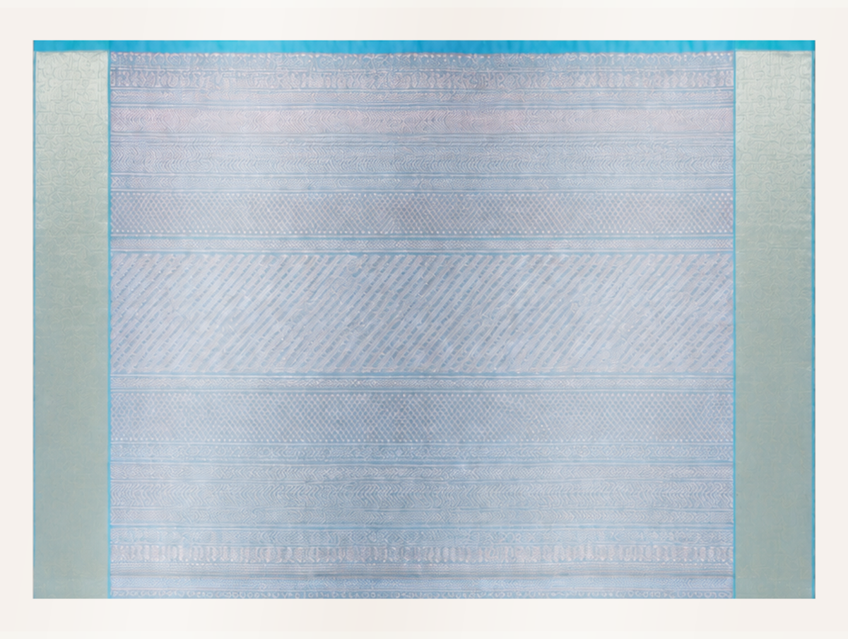 Close view of the ice blue and silver pallu with diamonds chevrons herringbone and fine geometric linework